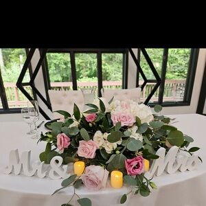 White 'Mr & Mrs' Sign wedding decor. Flowers and candles are not included